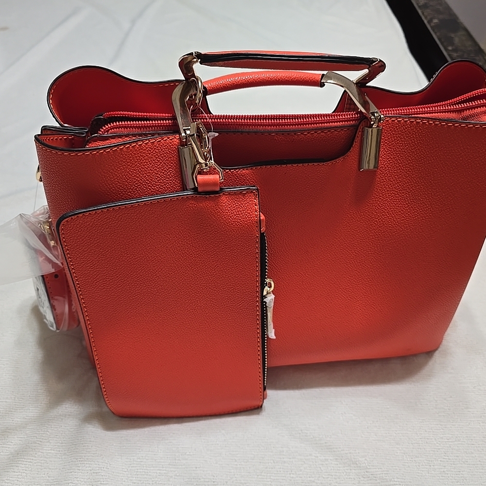 Vibrant Orange Satchel with Sleek Design and Gold Hardware